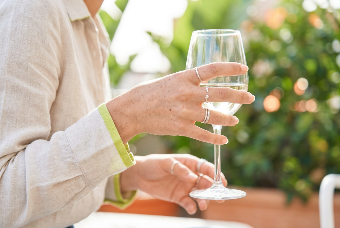 How to hold a wine glass.
